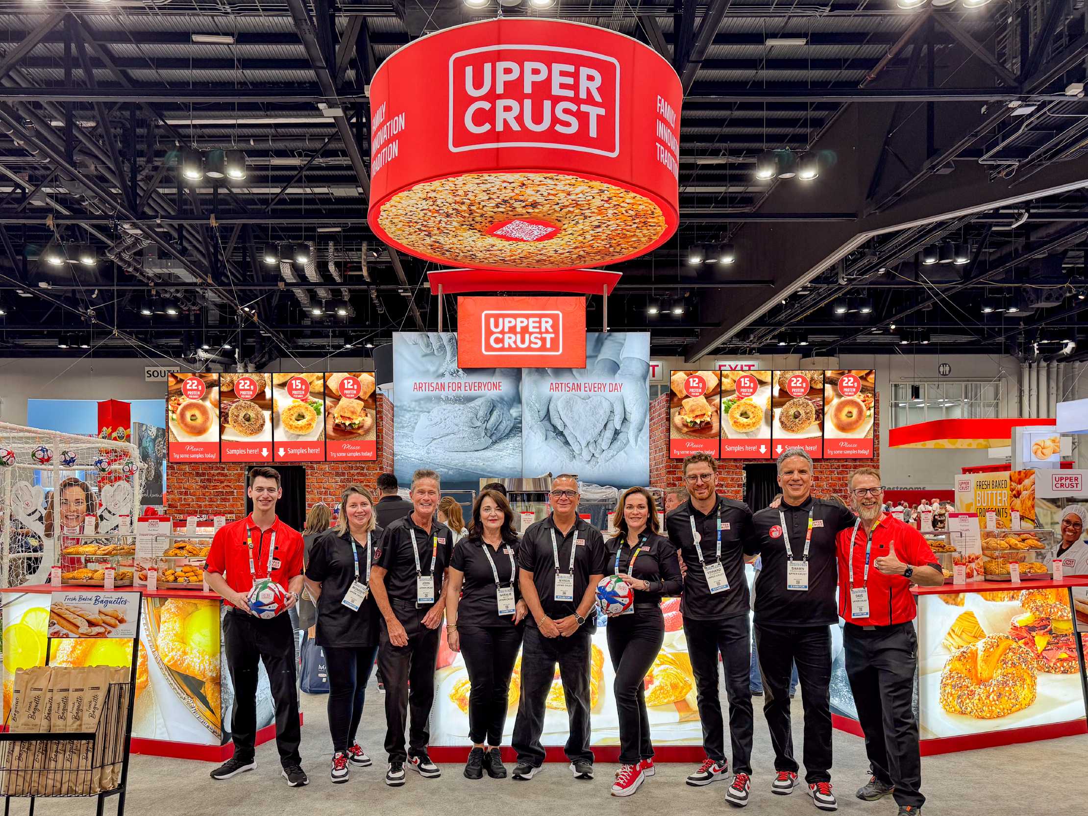 Upper Crust booth photo with sales team